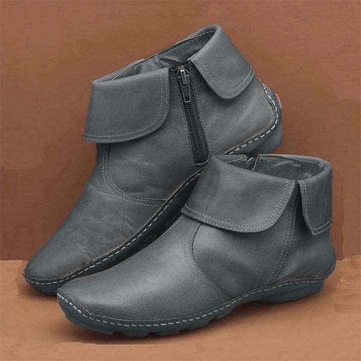 Wasserdichte Damenstiefel aus weichem Leder mit seitlichem Reißverschluss, ideal für Herbst- und Wintertage.