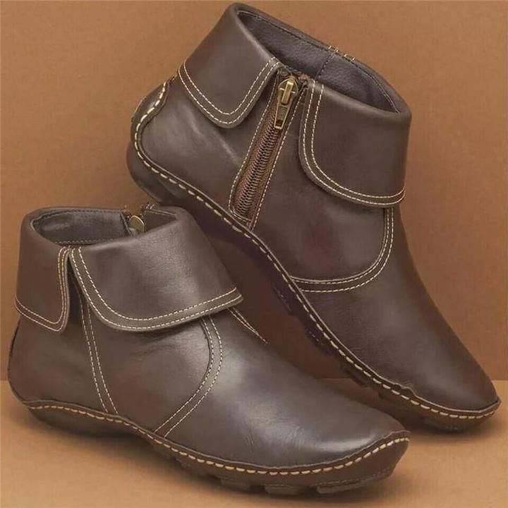 Wasserdichte Damenstiefel aus weichem Leder mit seitlichem Reißverschluss, ideal für Herbst- und Wintertage.