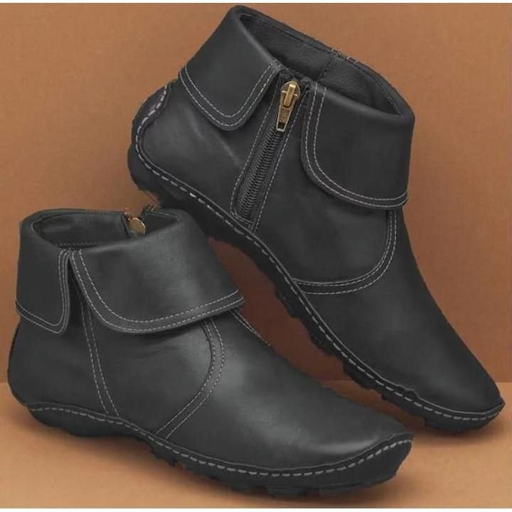 Wasserdichte Damenstiefel aus weichem Leder mit seitlichem Reißverschluss, ideal für Herbst- und Wintertage.