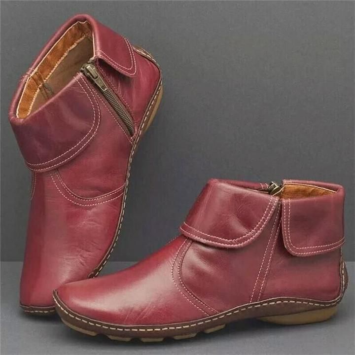 Wasserdichte Damenstiefel aus weichem Leder mit seitlichem Reißverschluss, ideal für Herbst- und Wintertage.