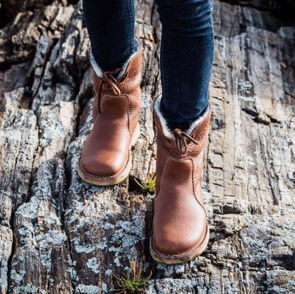 Wasserdichte Winterstiefel für Frauen, ideal für kalte Herbst- und Wintertage, mit warmem Futter und rutschfester Sohle.